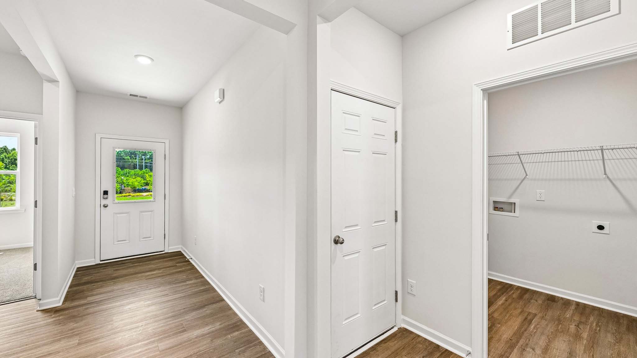 Welcoming foyer with wood floors, view of home interior