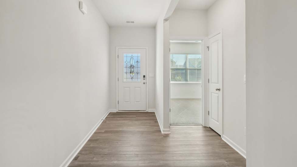 Welcoming foyer with wood floors, view of home interior