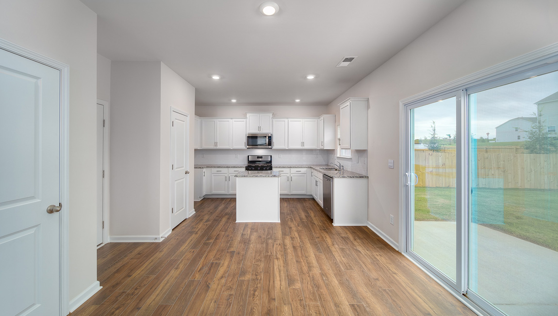 Breakfast space near kitchen, sliding glass doors beside
