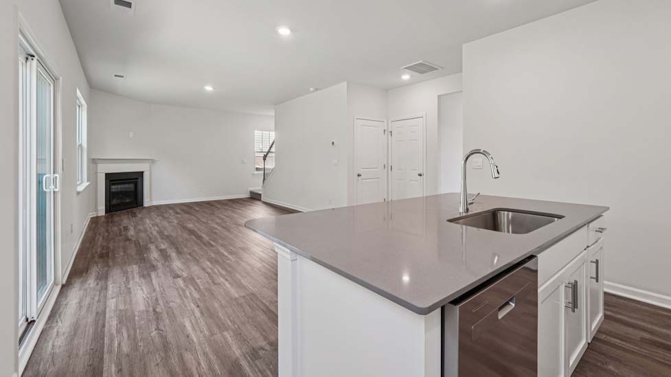 Kitchen and island with stainless steel appliances