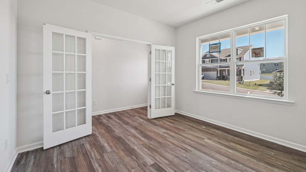 Dining or flex room with french doors and large window