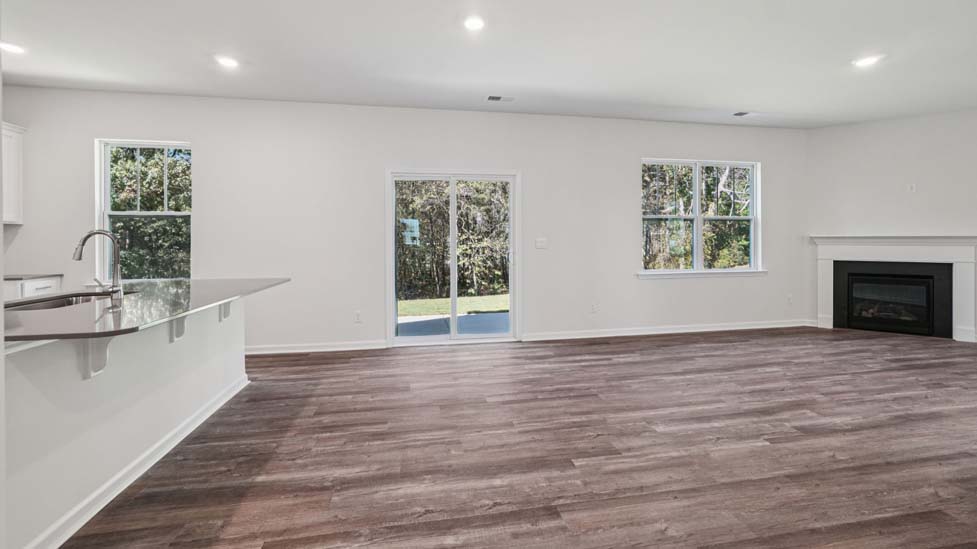 Living room with sliding glass doors and fireplace