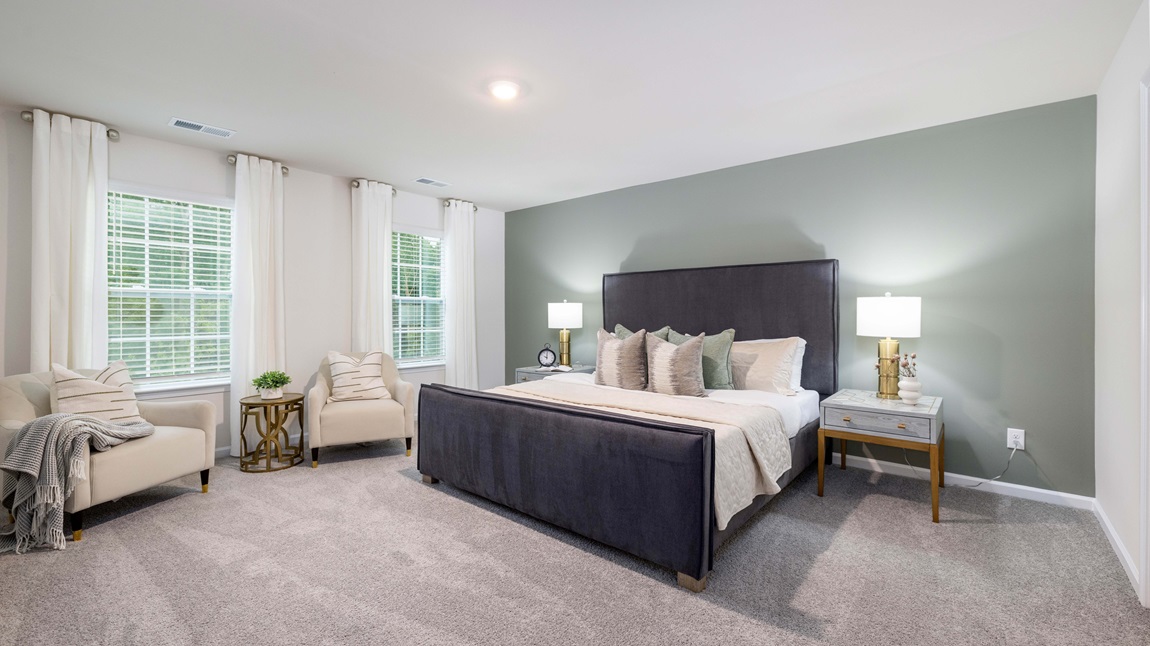Carpeted bedroom with large windows