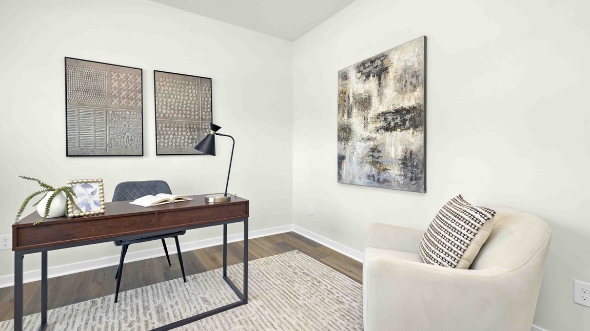Carpeted bedroom with large windows