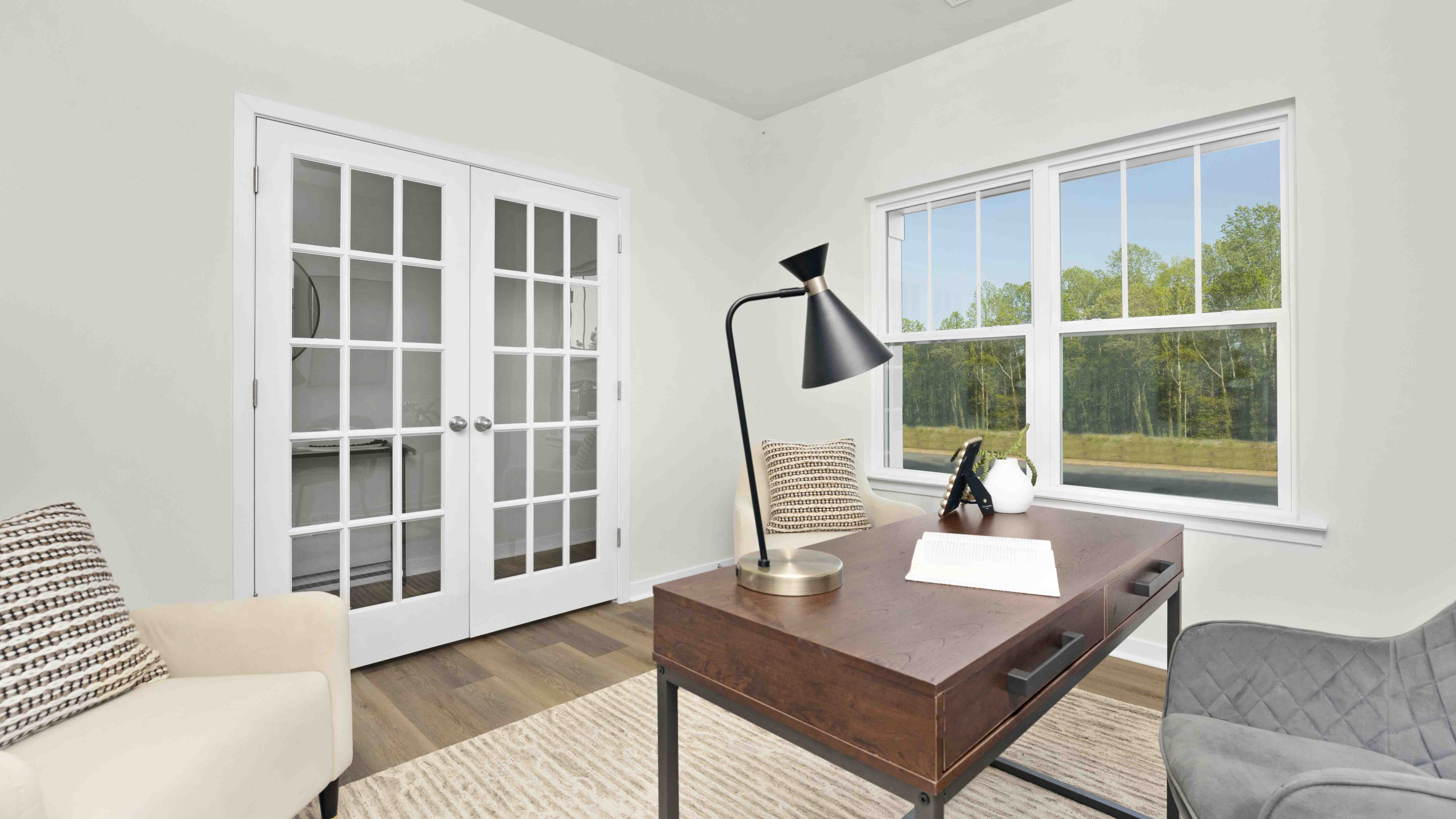 Carpeted bedroom with large windows