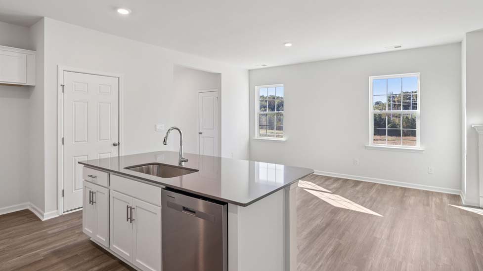 Kitchen and island with stainless steel appliances