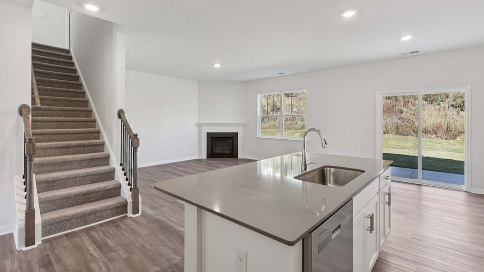 kitchen and island with stainless steel appliances