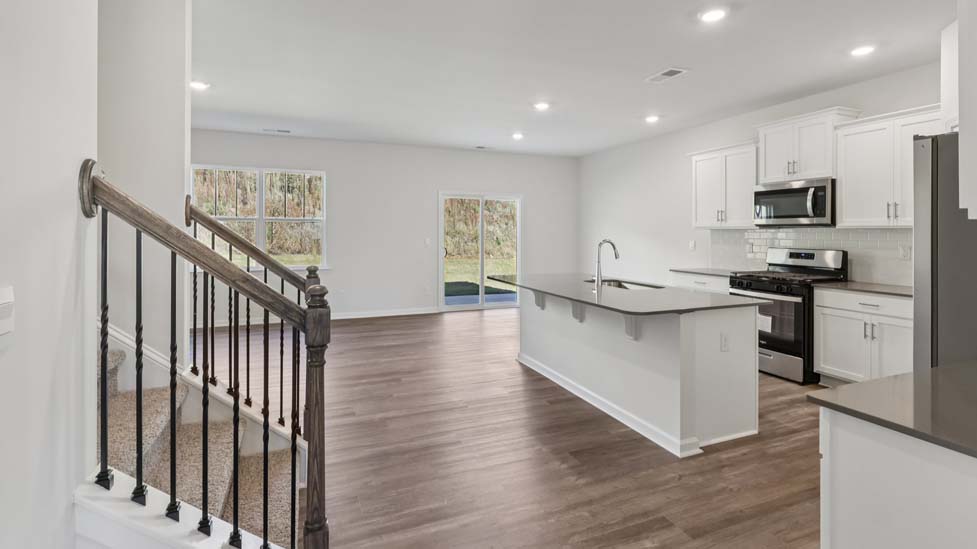 kitchen and island with stainless steel appliances