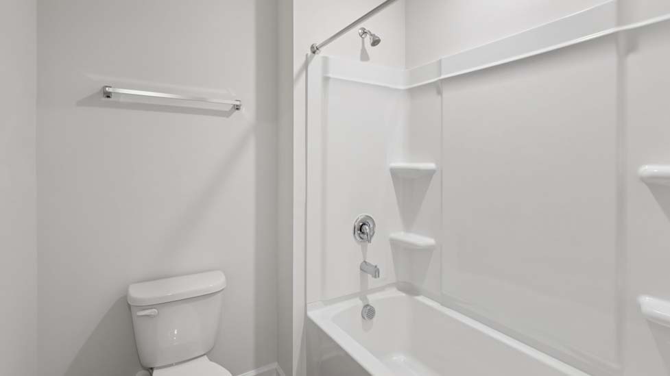 Bathroom with doubke sink vanity and bathtub shower combo