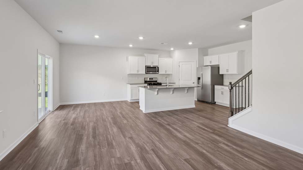 kitchen and island with stainless steel appliances