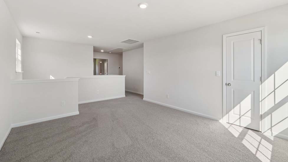 Carpeted upstairs loft
