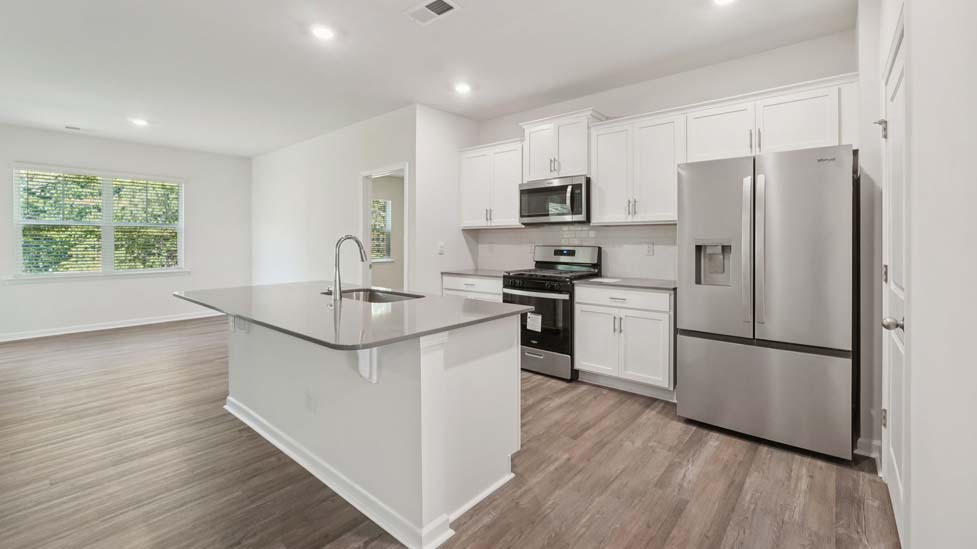 kitchen and island with stainless steel appliances