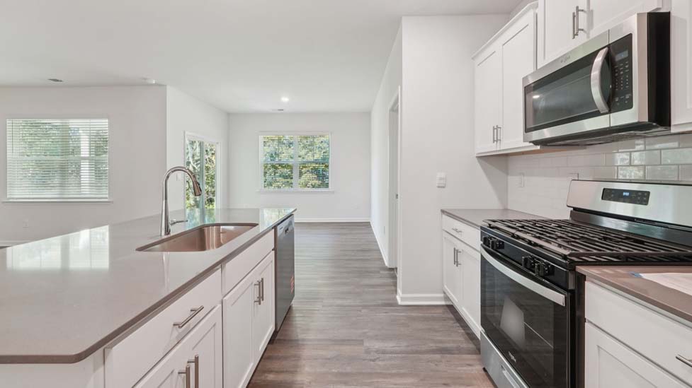 kitchen and island with stainless steel appliances