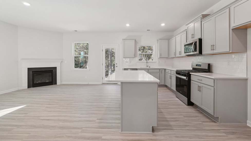 kitchen and island with stainless steel appliances