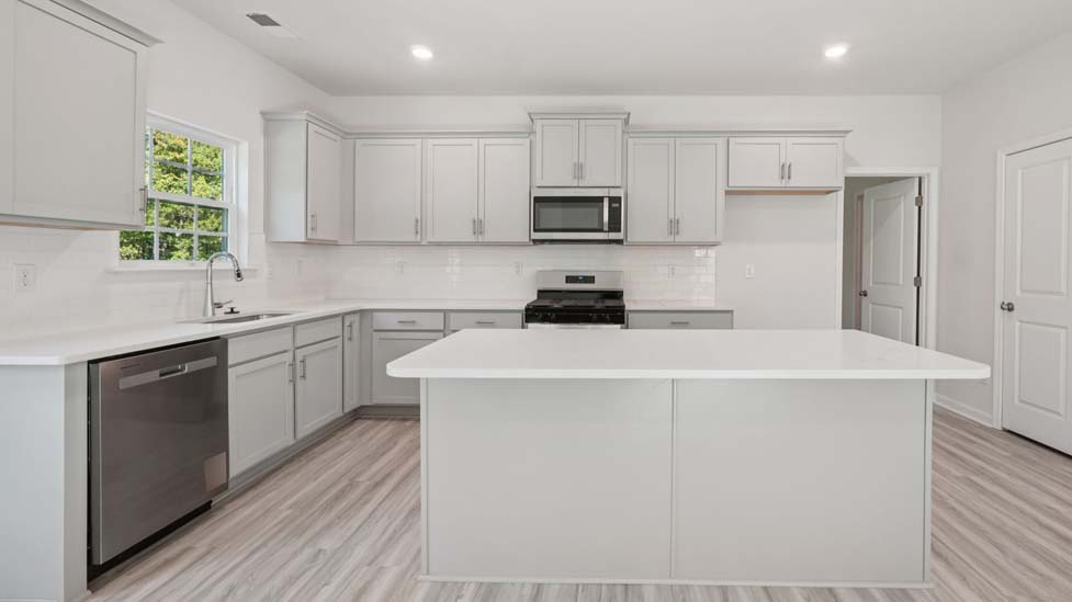 kitchen and island with stainless steel appliances