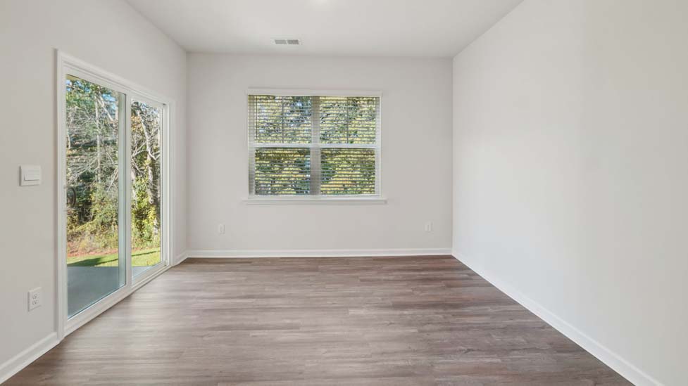 carpeted bedroom with large window