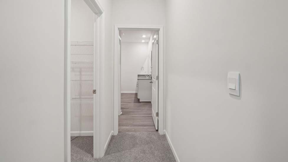 carpeted bedroom with large window