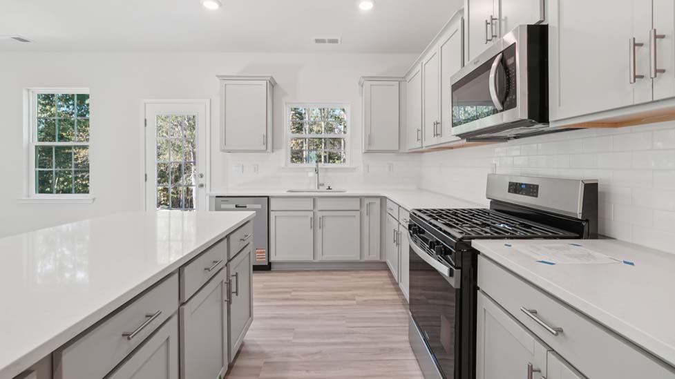 kitchen and island with stainless steel appliances