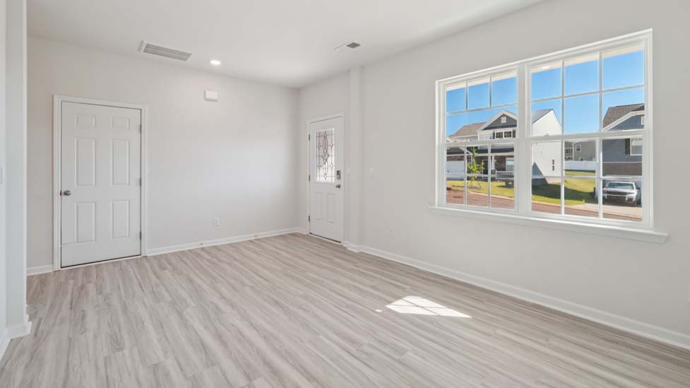 carpeted bedroom with large window