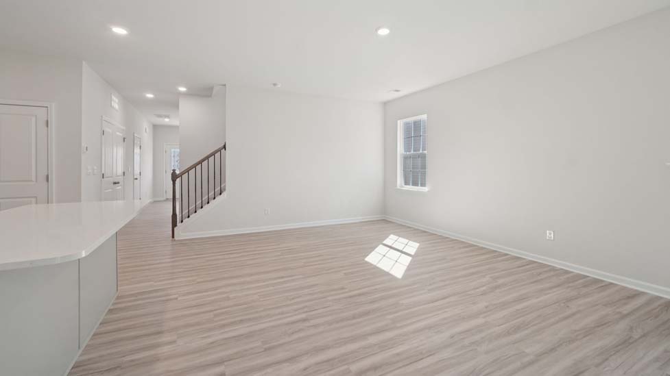 carpeted bedroom with large window