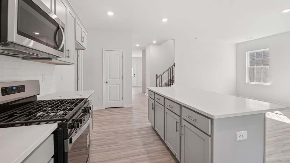 kitchen and island with stainless steel appliances