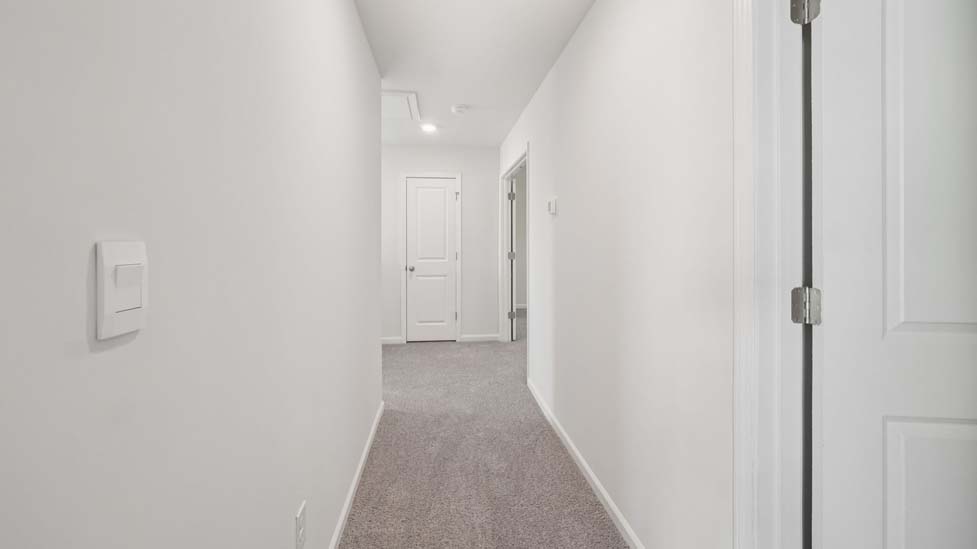 carpeted bedroom with large window