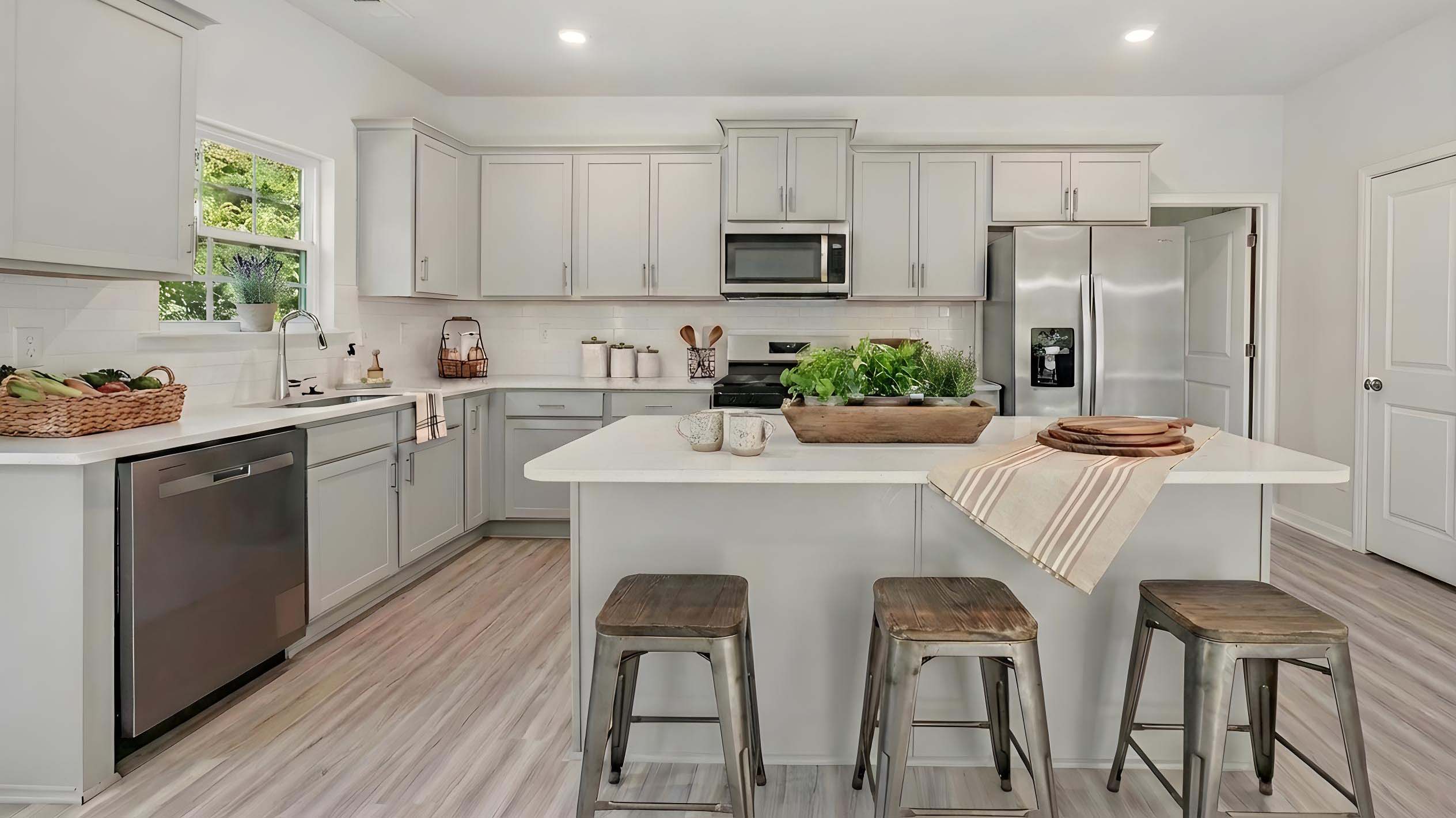kitchen and island with stainless steel appliances