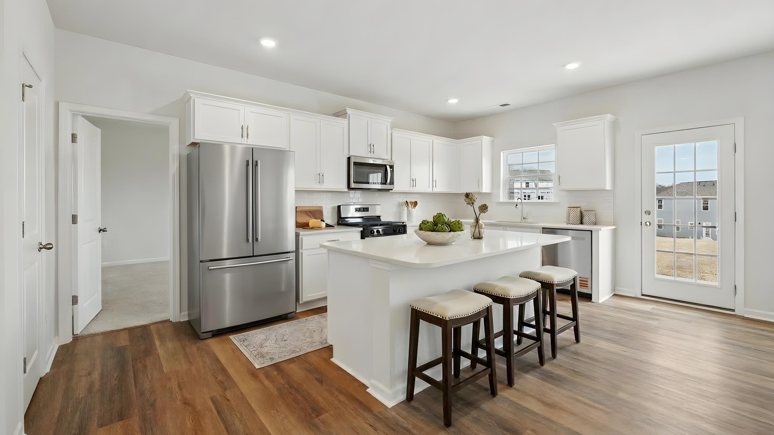 kitchen and island with stainless steel appliances