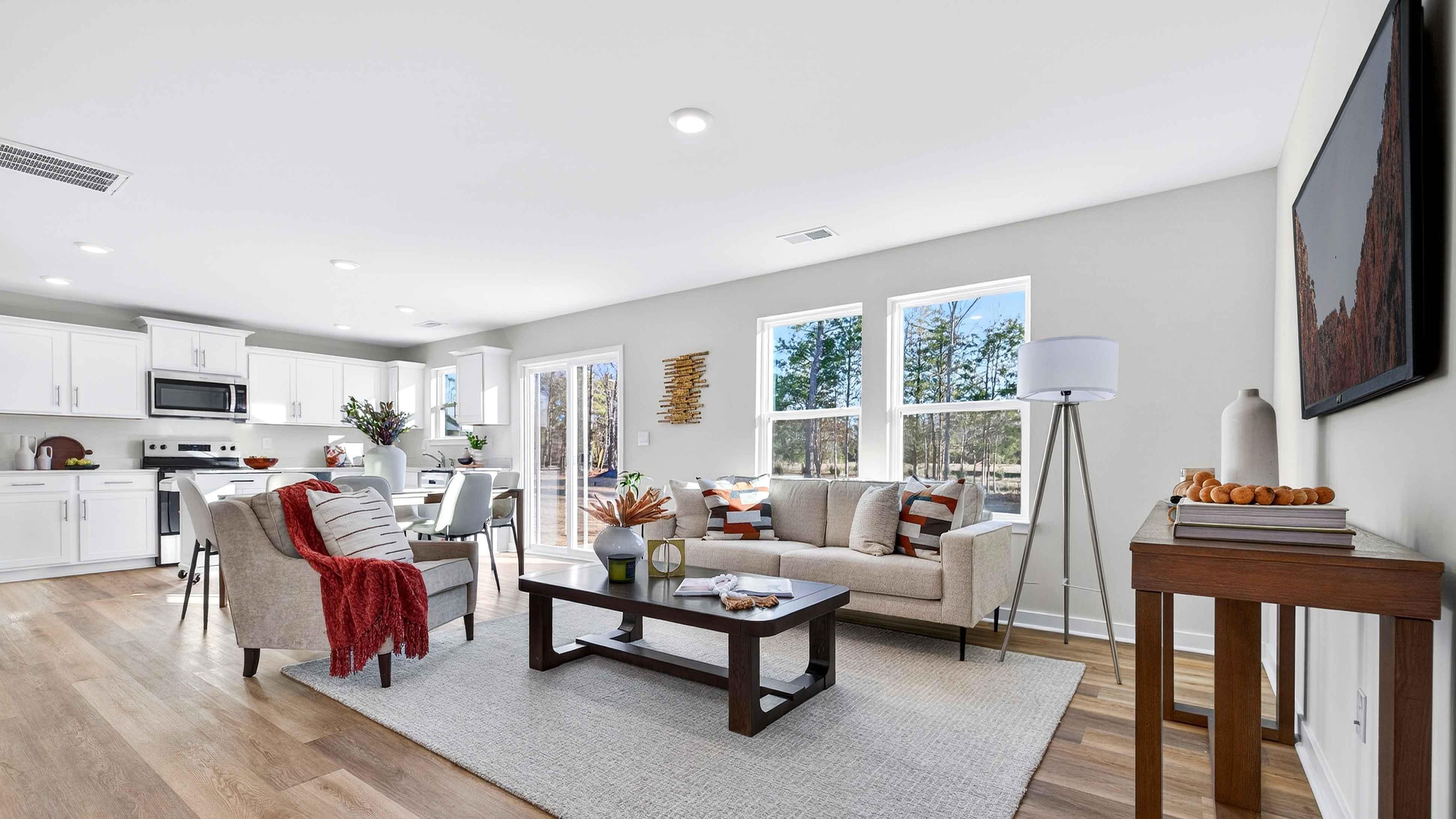 Open living room by kitchen and stairs