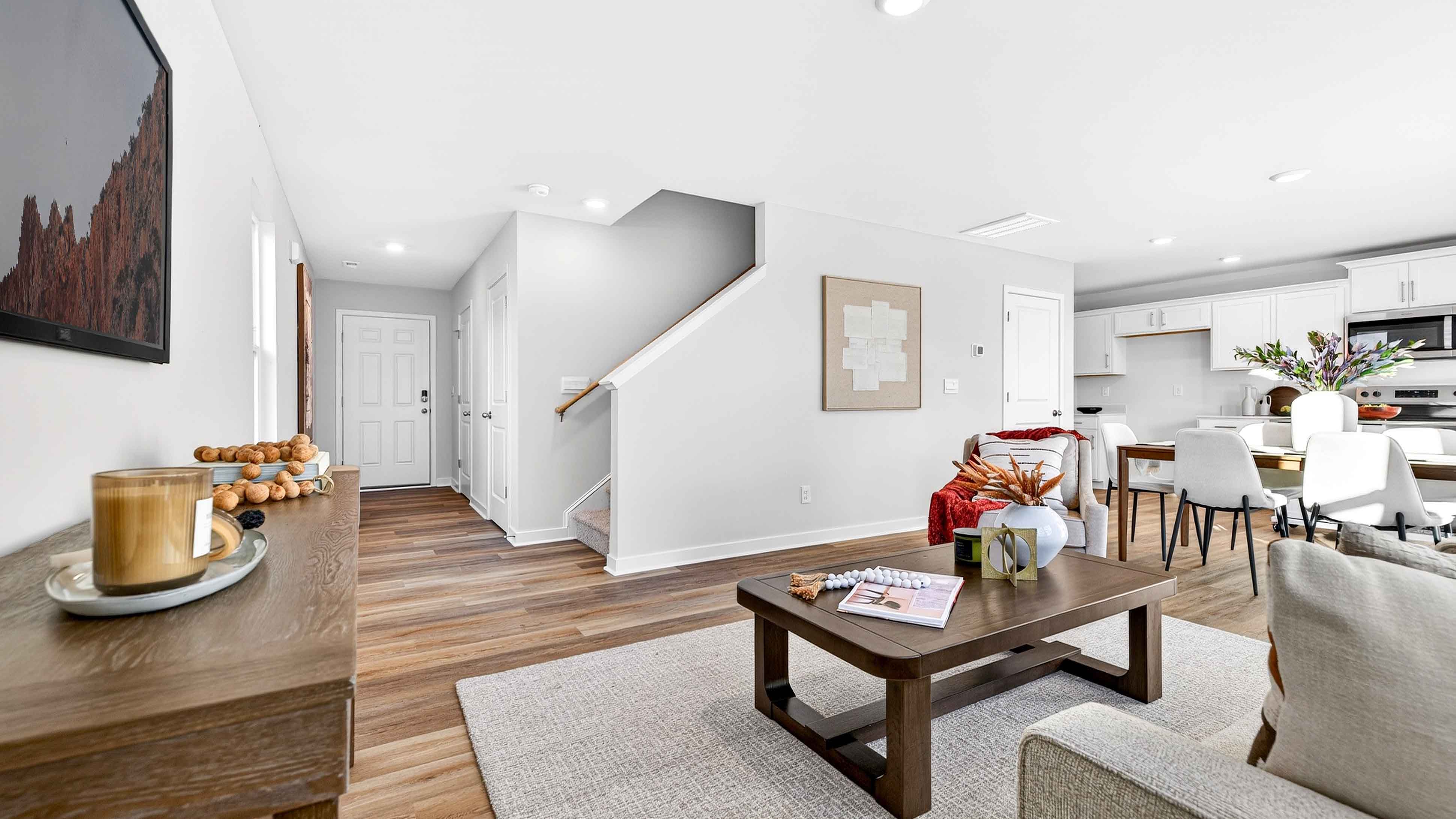 Open living room by kitchen and stairs
