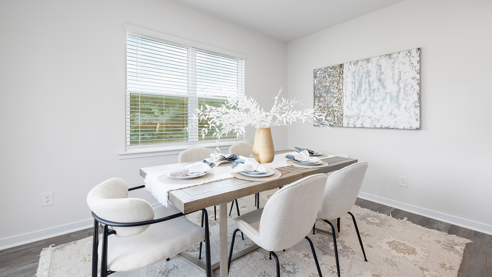 Breakfast area with wood floors, large window, and sliding glass back door
