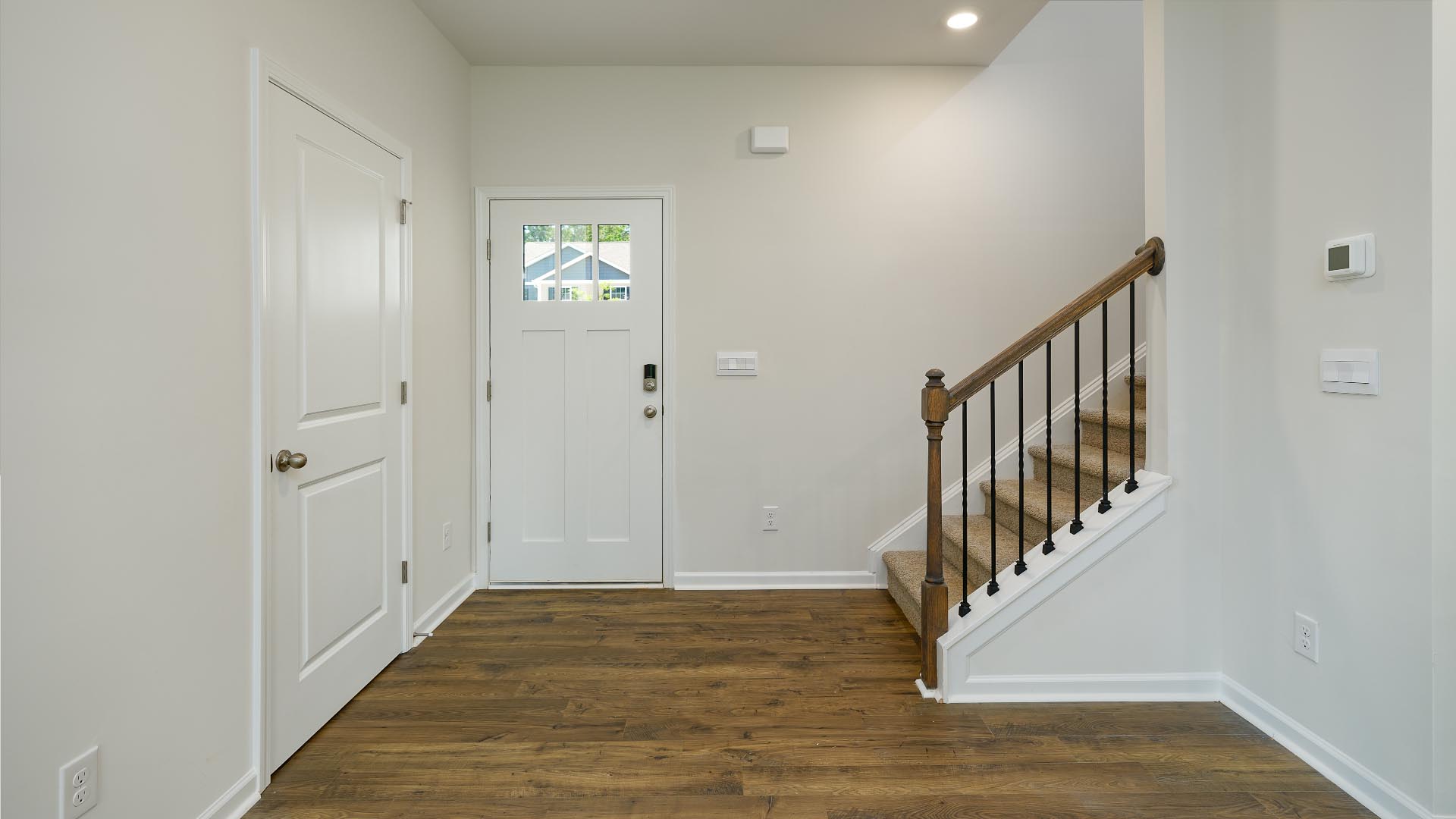Welcoming foyer with view of staircase