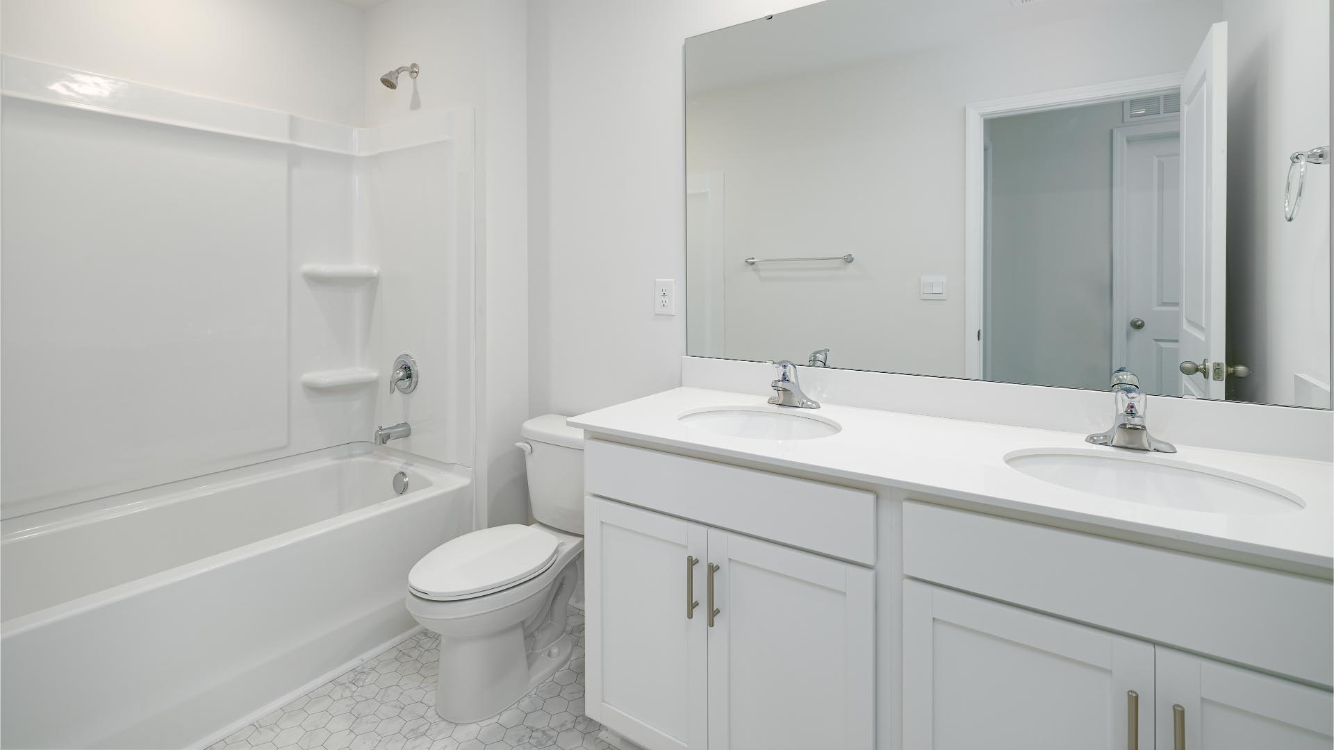 Bathroom with double sink vanity and bathtub shower combination