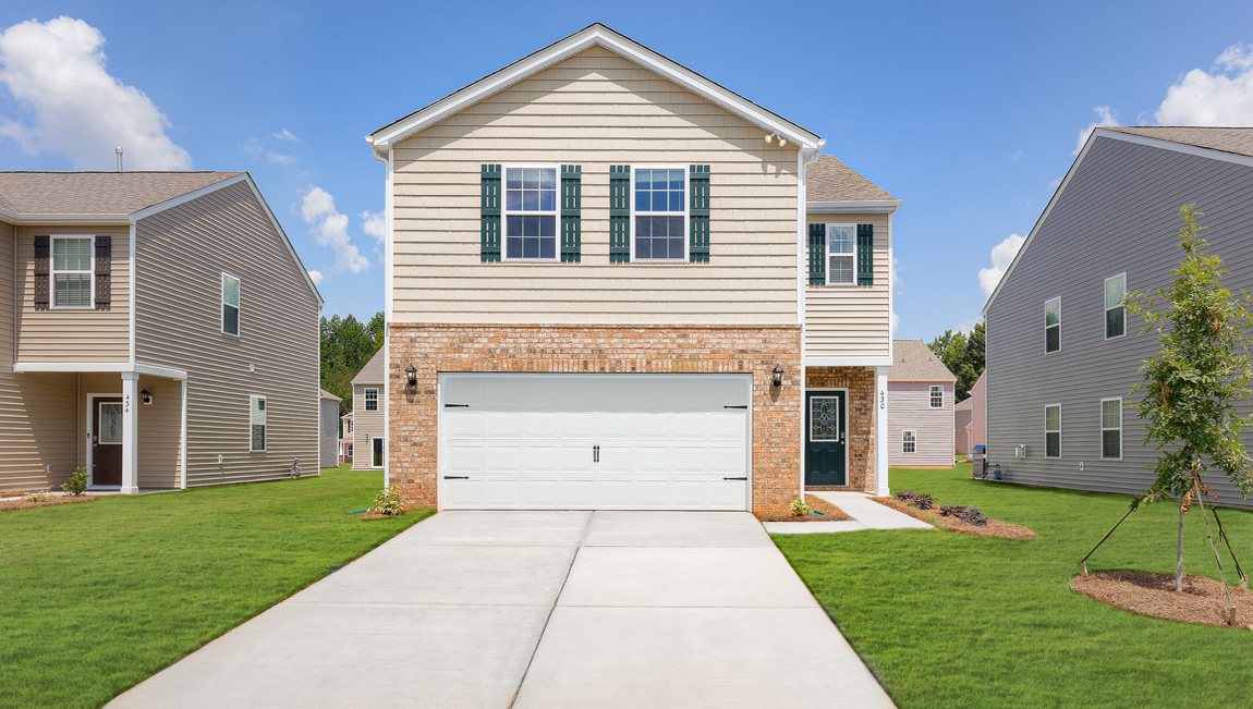 Elston front exterior with siding and two car garage