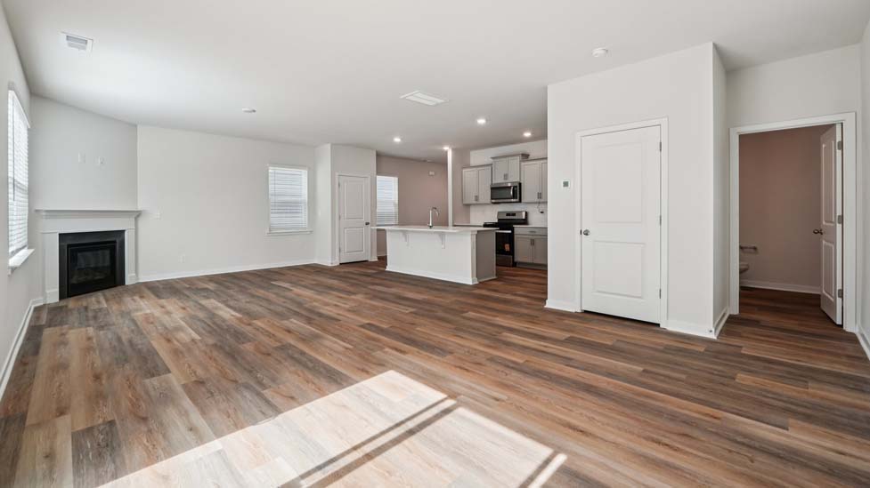 Family room with fireplace and large windows