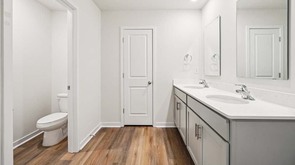 Bathroom with double sink vanity and walk in shower