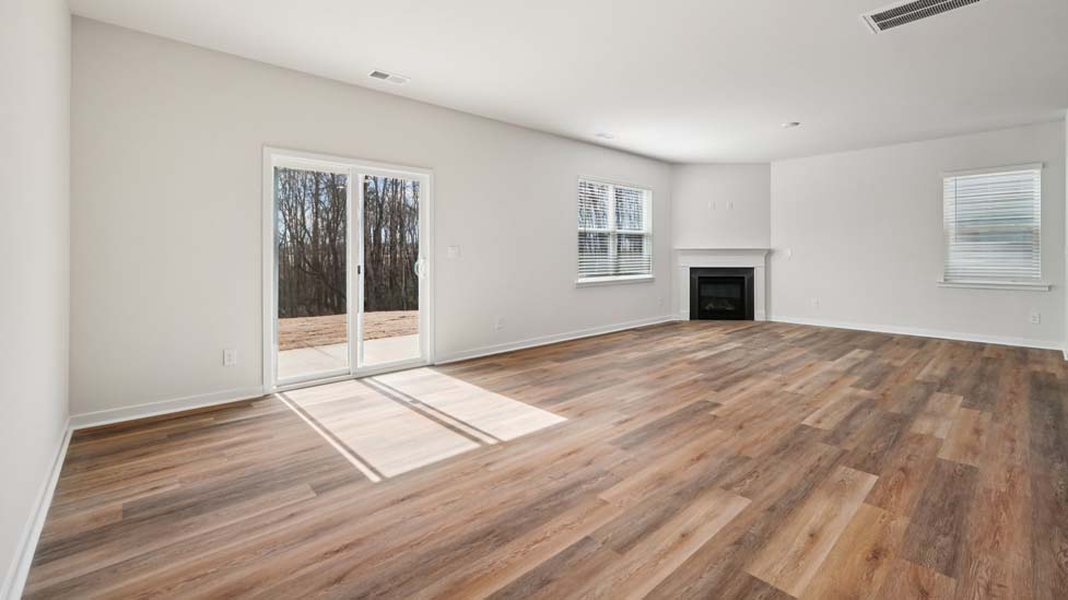 Family room with fireplace and large windows