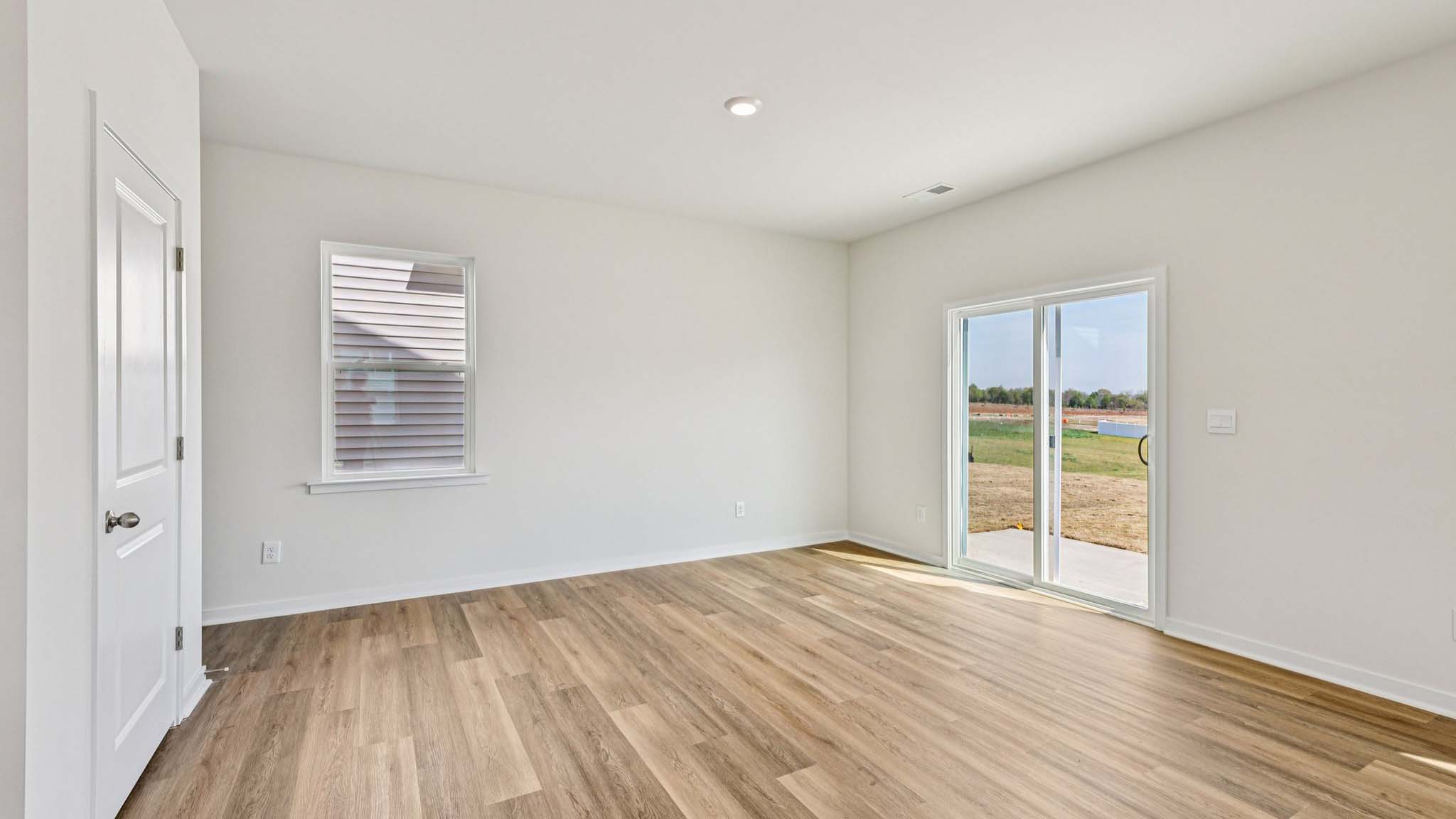 Dining area with wood floor and sliding glass door