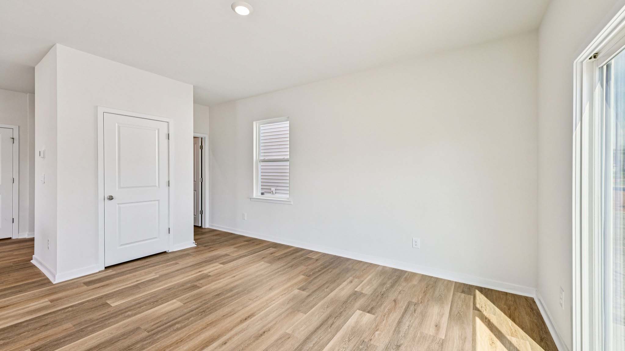 Dining area with wood floor and sliding glass door