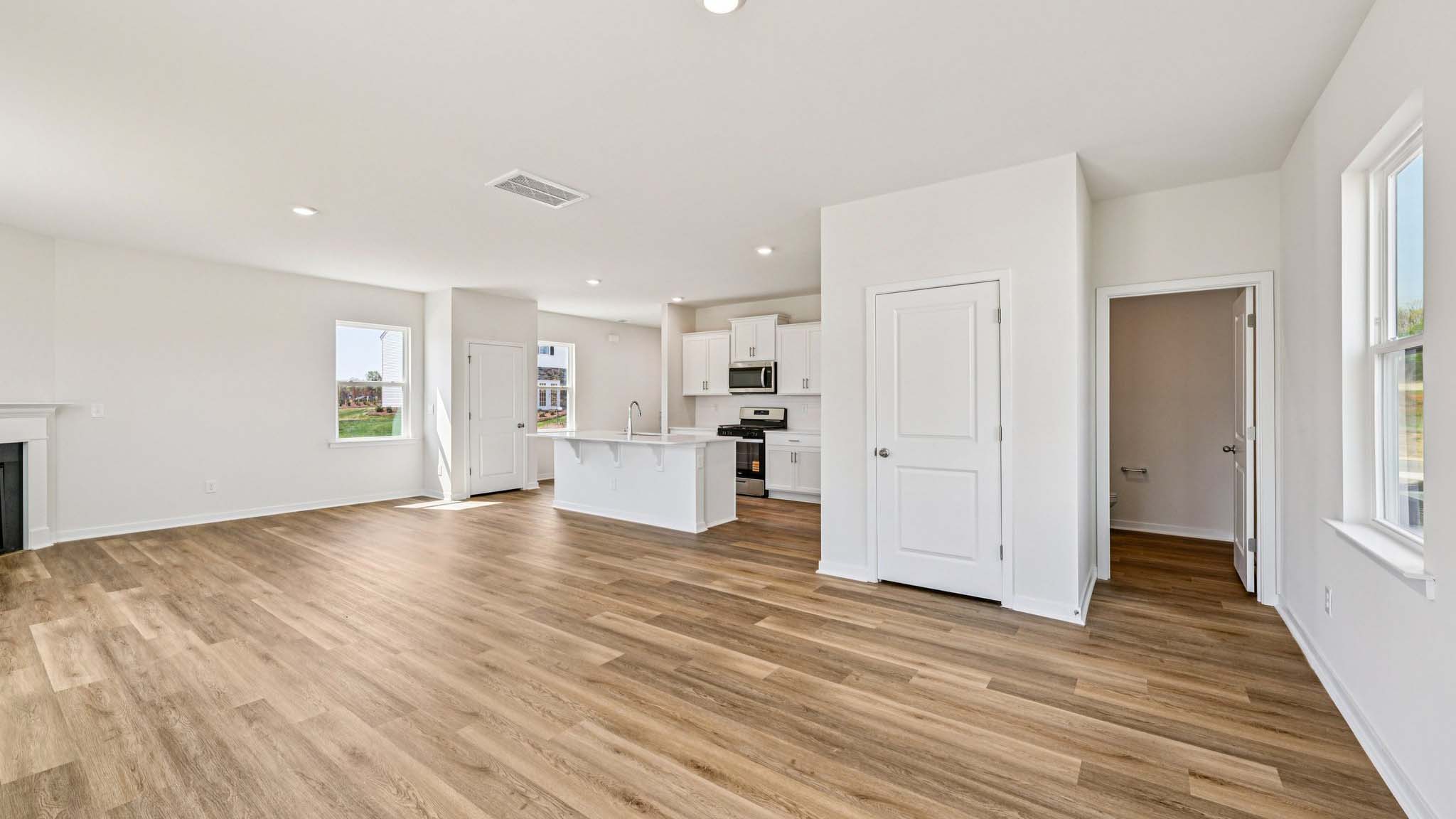 Spacious family room with windows and fireplace