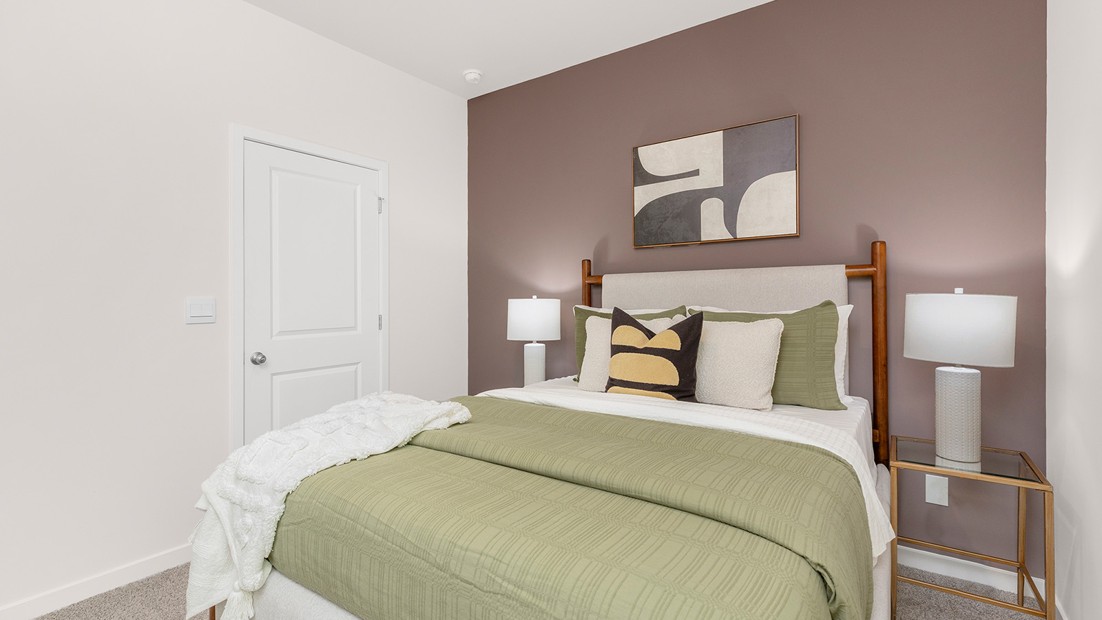 Carpeted bedroom with large window