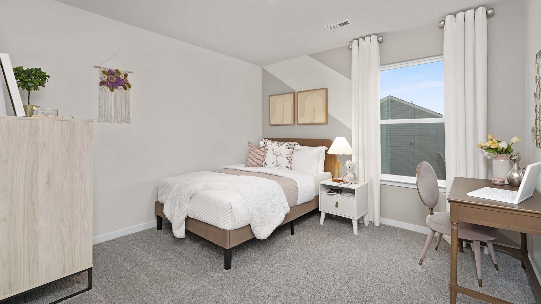 Carpeted bedroom with large window