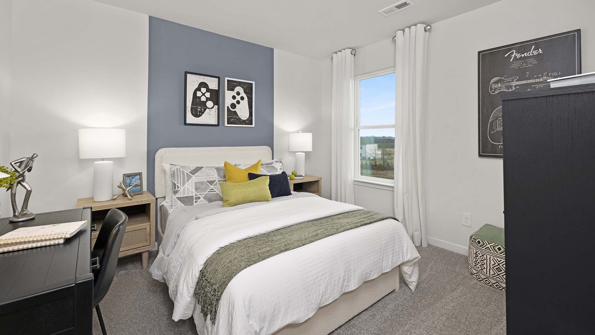 Carpeted bedroom with large window