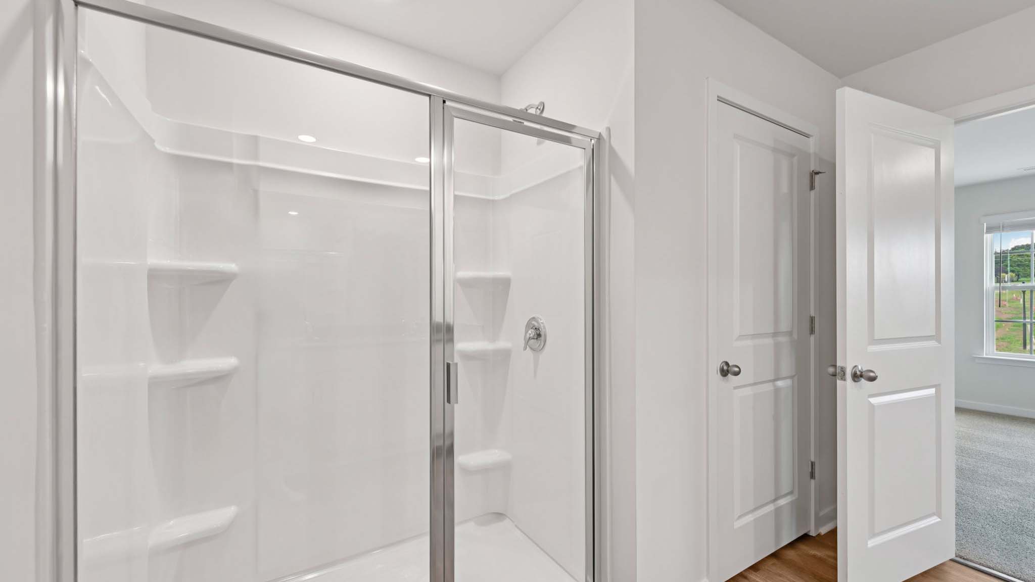 Bathroom with standing glass shower