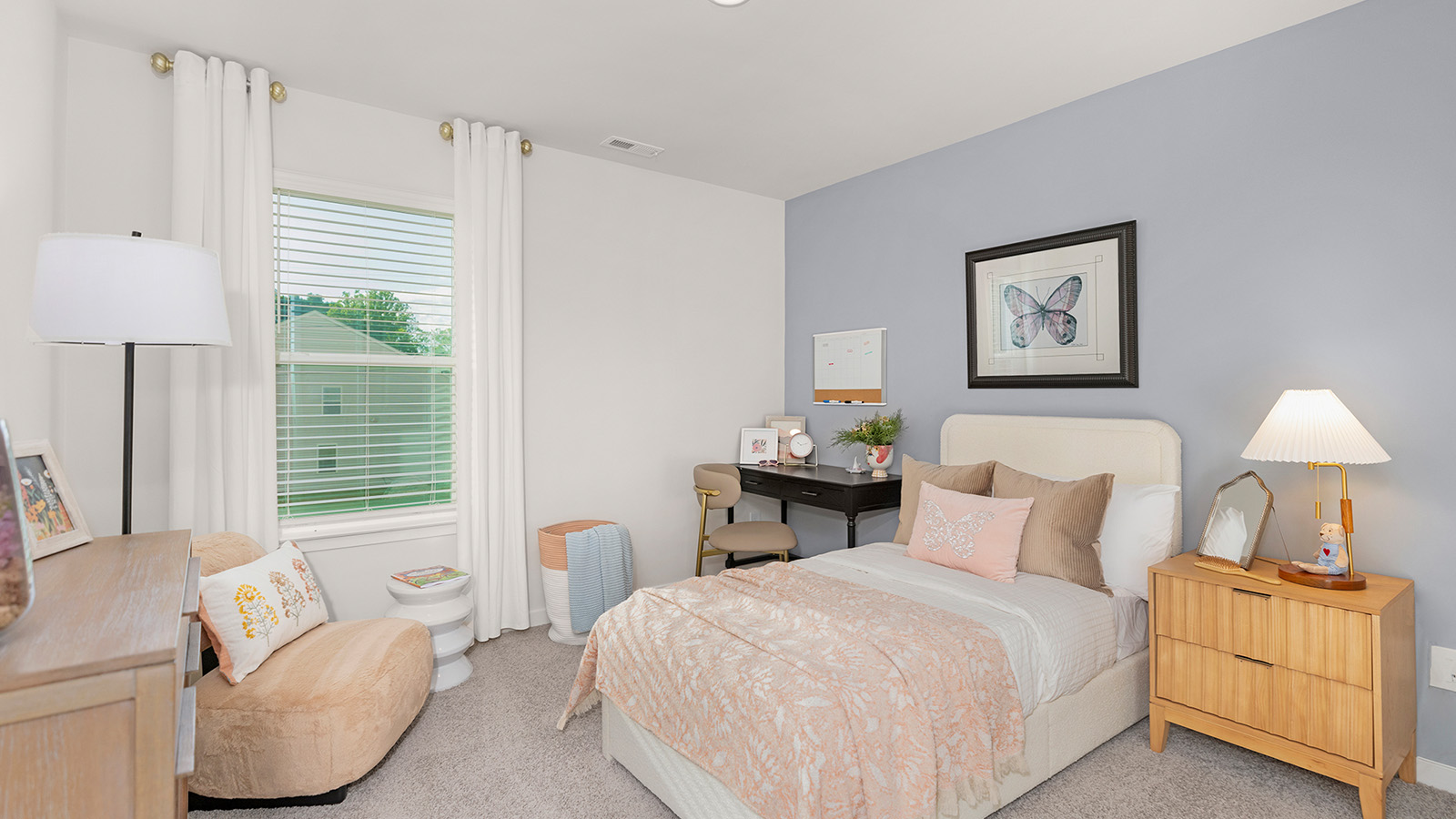Carpeted bedroom with large window