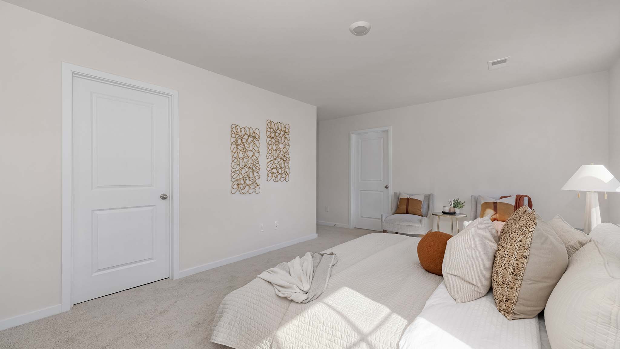 Carpeted bedroom with large window