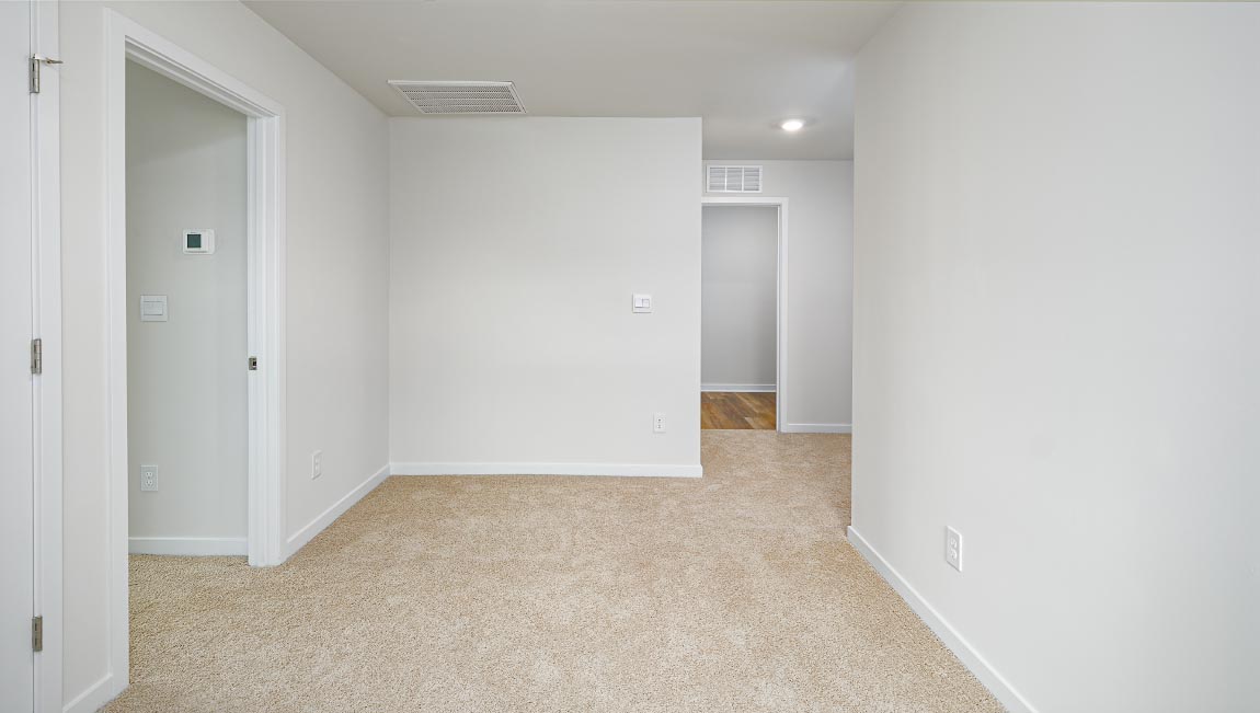 Loft with carpet and large window