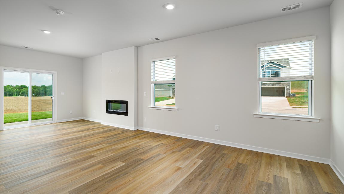 Dining space beside kitchen and living room with large window