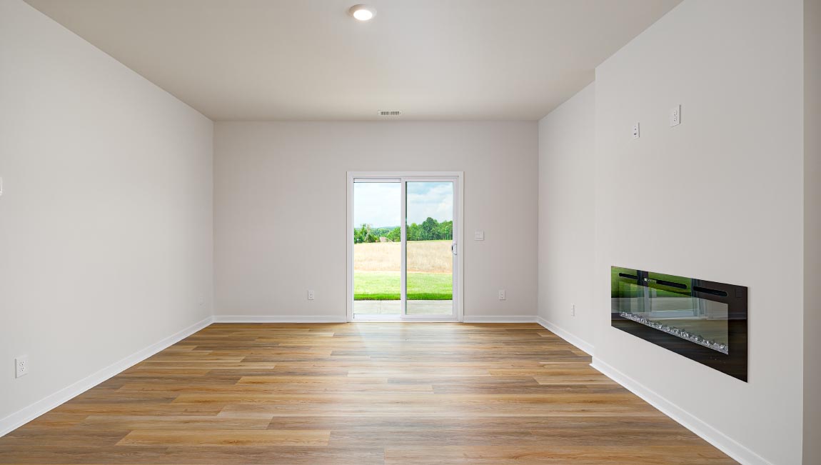 Living room with electric fireplace and sliding glass back door