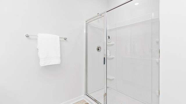 primary bathroom with standing glass shower